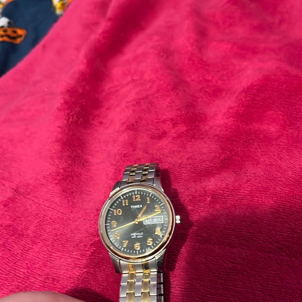 Men’s gold timex watch